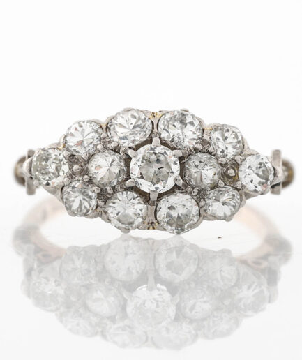 1928 Art Deco East West cluster of old cut diamonds.